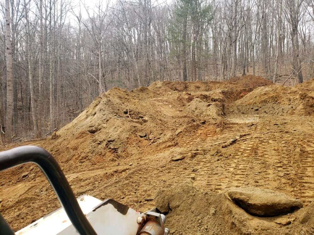 Lot clearing and basement excavation for new home construction in Nellysford, VA 22958
